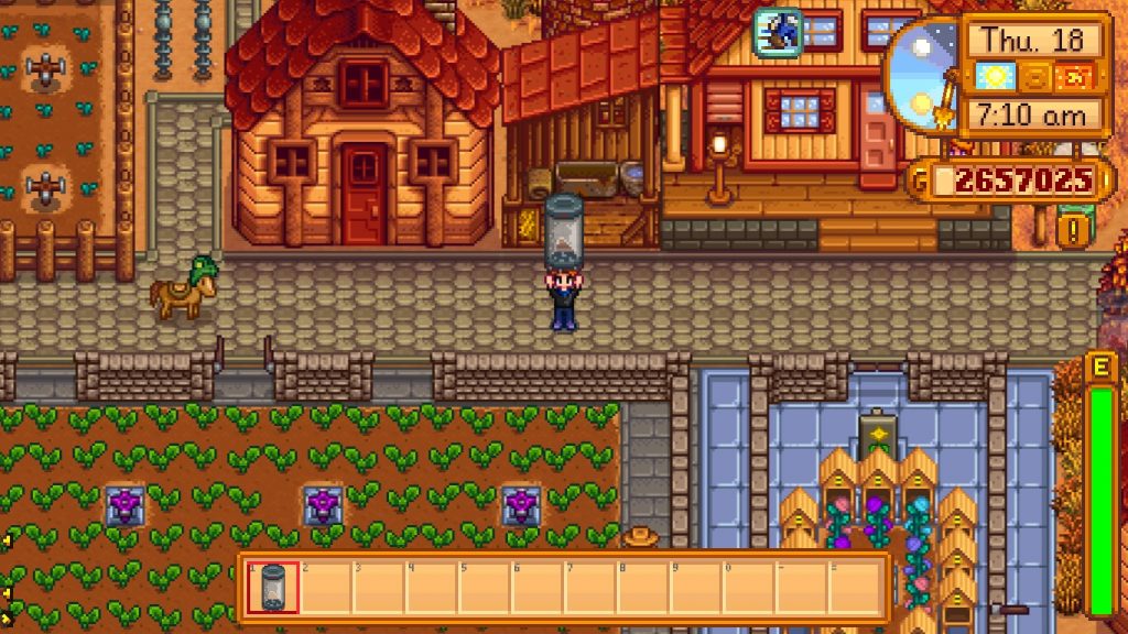 The player holding a shattered empty capsule in the middle of the farm.