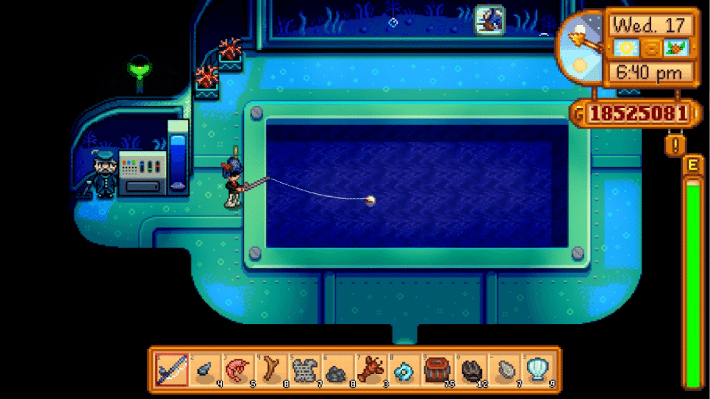 The player fishing inside the Fishing Submarine at the Night Market in Stardew Valley.