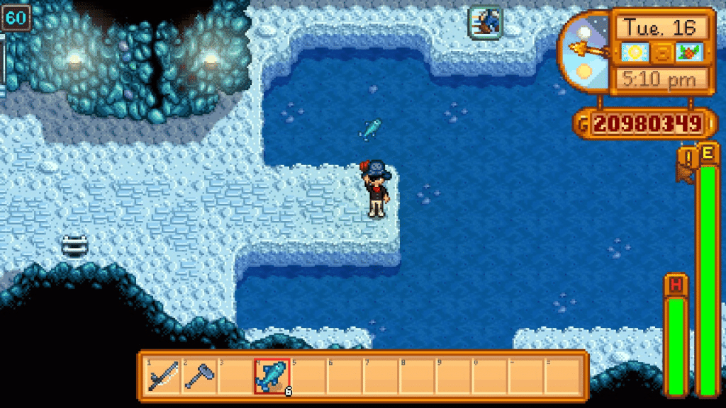 The player holding an Ice Pip in Stardew Valley.