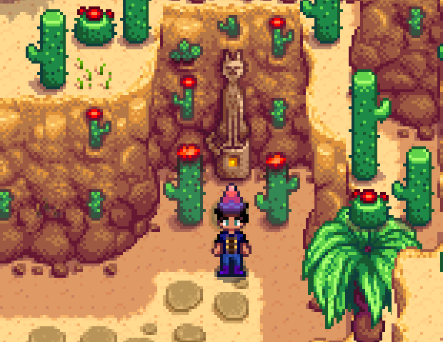 Character standing next to the warp point in the Calico Desert in Stardew Valley